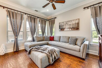 2nd floor living area. View of green space.  Curta