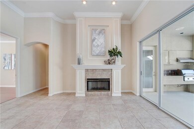 Open family room boasts wood burning fireplace and