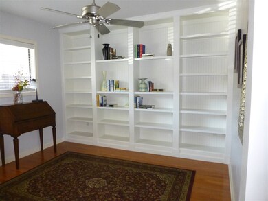 The book cases are custom made!  This office is ri