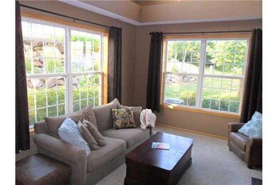 Living Room. Surrounded by glass and Landscaping