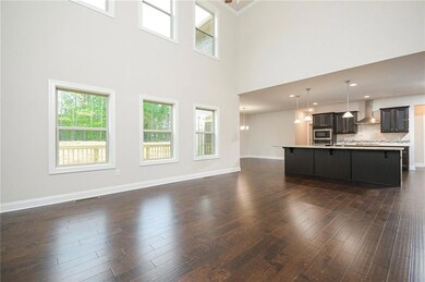 Unfurnished living room featuring visible vents, d