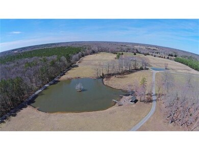 AERIAL VIEW OF FRONT POND W/GAZEBO LOOKING TO FRON