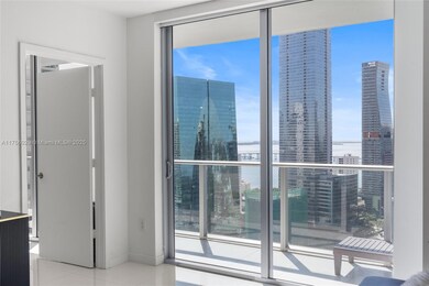 view from living area - entrance to master bedroom  - motorized shades in living area