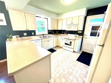 Kitchen cabinetry has many rollouts! Door on the r