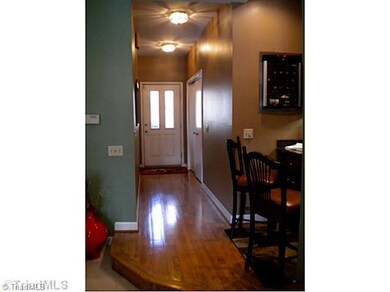 Entry. Hard woods in the foyer entry leading to the Great Room.