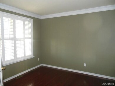 The living room features French doors, for added p