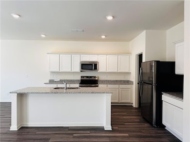 Kitchen with appliances with stainless steel finis