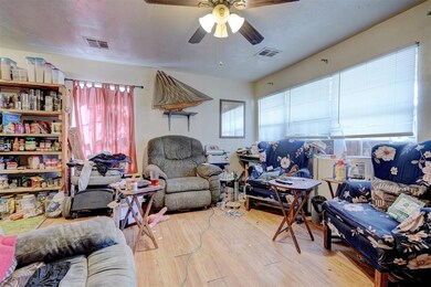 Living room featuring light wood-type flooring, ce