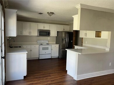 Kitchen featuring stainless steel microwave, elect