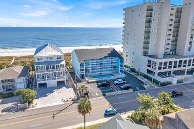 Drone / aerial view with a water view and a beach 