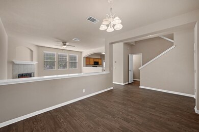 Unfurnished living room featuring a tile fireplac