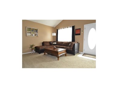 Tiled front entry, large picture window, newer car