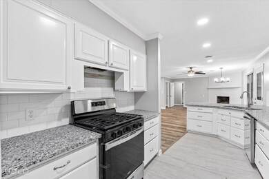 Kitchen featuring crown molding, appliances with s