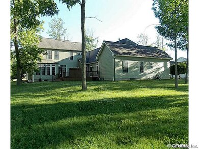 Exterior Back. Deep lot with view of deck