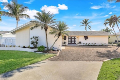Ranch-style house featuring a front yard and frenc