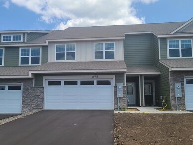 Beautiful elevation with a mixture of James Hardie shakes, siding, board and batten.  Image is of model, colors may vary.