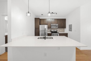 Kitchen featuring tasteful backsplash, electric p
