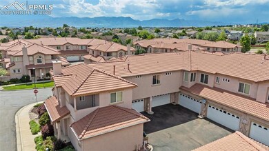 Aerial perspective of suburban area with a mountainous background