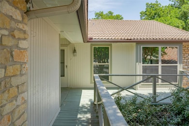 View of exterior entry featuring stone siding and