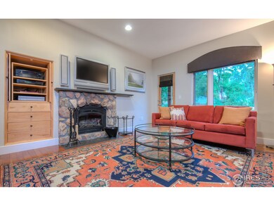 Living room w/ wood burning catalytic fireplace