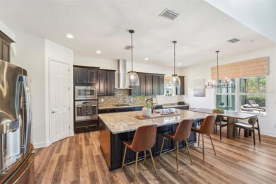 BEAUTIFUL CABINETS AND STUNNING COUNTERTOPS ELEVATE THIS DREAM KITCHEN! AND THE GAS STOVE IS A CHEFS DREAM!