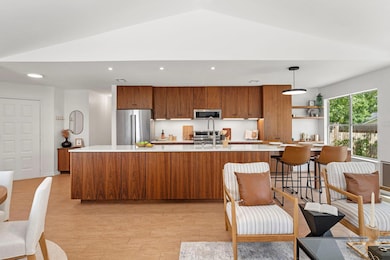Kitchen featuring light countertops, lofted ceili