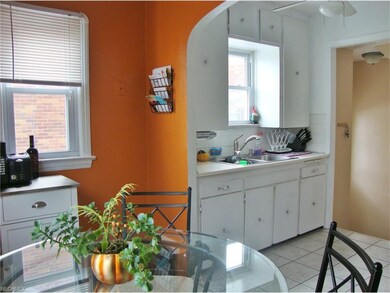 White cabinetry with double sink and newer Moen fa
