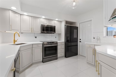 COASTAL LIVING AT ITS BEST FOR BEACH & BOAT LOVERS IN LAUDERDALE BY THE SEA. THIS REMODELED FULLY FURNISHED ~ TURNKEY SPLIT FLOOR PLAN FEATURES 2/BEDS 2/BATHS LOCATED DIRECTLY ON THE CANAL W/ AMAZING WATER VIEWS. KITCHEN FEATURES SAMSUNG BESPOKE SERIES APPLIANCES W/ FAMILY HUB, QUARTZ COUNTERTOPS, NEW TANKLESS HWH & WHOLE UNIT WATER FILTRATION. IN UNIT LG WASHER/ DRYER, 24