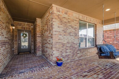 Property entrance with brick siding