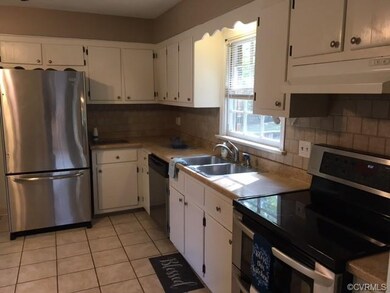 Kitchen with Tile floor and backsplash