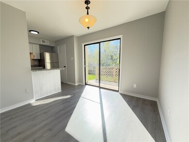 Unfurnished living room featuring dark hardwood /