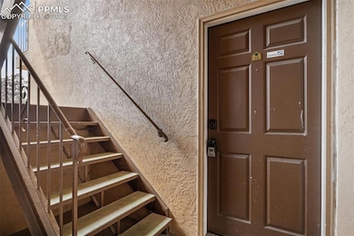 Property entrance with stucco siding