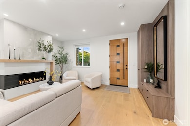 Main entry with built-in coat closet, shoe storage and bench. Classy gas fireplace anchors the living room.
