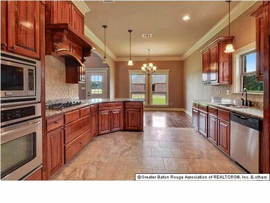 Kitchen with cypress cabinets, slab granite and st