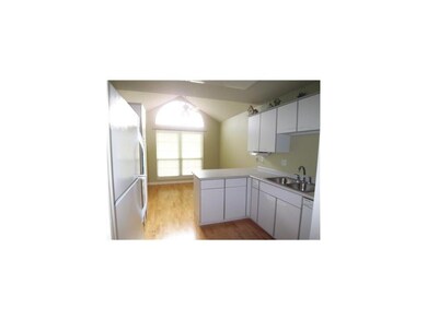 Kitchen. With new hardwood floors installed in 200