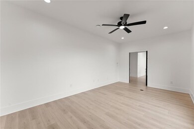 Spare room featuring recessed lighting, light wood-style flooring, and ceiling fan