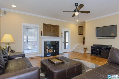 Fireplace in living room with hardwood floors and 
