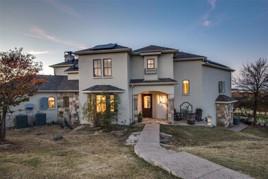 Follow the pathway up to the front entry. You will be entering in on level 2. (The garage is considered level 1) Notice the solar panels that will help you save on your utilities.