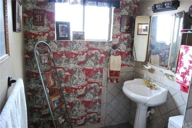 One of the two bathrooms features upgraded tile, s