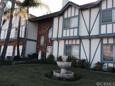 Sideview of home front, with fountain and landscap