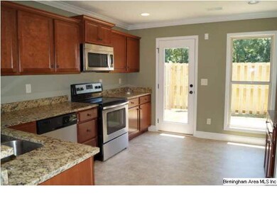 Kitchen has granite countertops