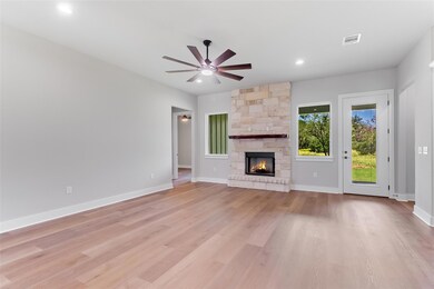 Unfurnished living room with ceiling fan, light w