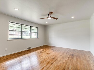 The black windows offer an attractive modern look against the warm white walls.  Natural light is abundant in the home.