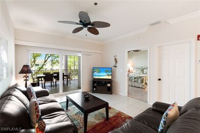Living area with ornamental molding, light tile pa