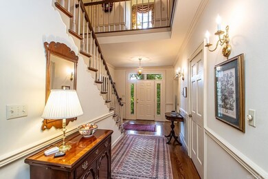 Large Hardwood Entry w/chair rail & crown molding