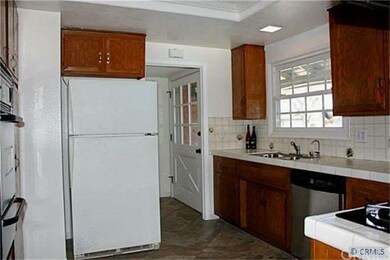 Kitchen with frig to front door
