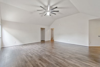 Large open living space with high ceilings offering plenty of space for all your Texas-sized furnishings!