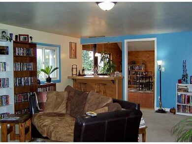 Living Room. large living room has a 2nd woodstove