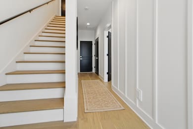 Foyer - 1st bedroom/bath and washer + dryer on the main floor