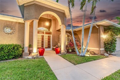 Exterior entry at dusk featuring a yard